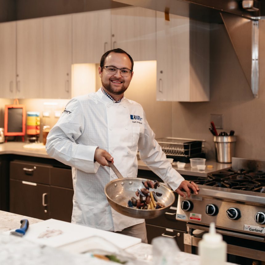 Chef cooking with pan